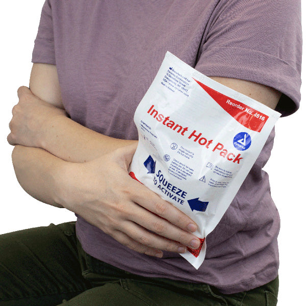 Lady using instant hote pack for muscle pain relief