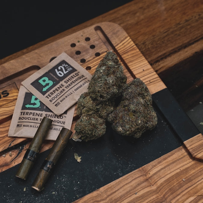 a rock and a cigarette on a table