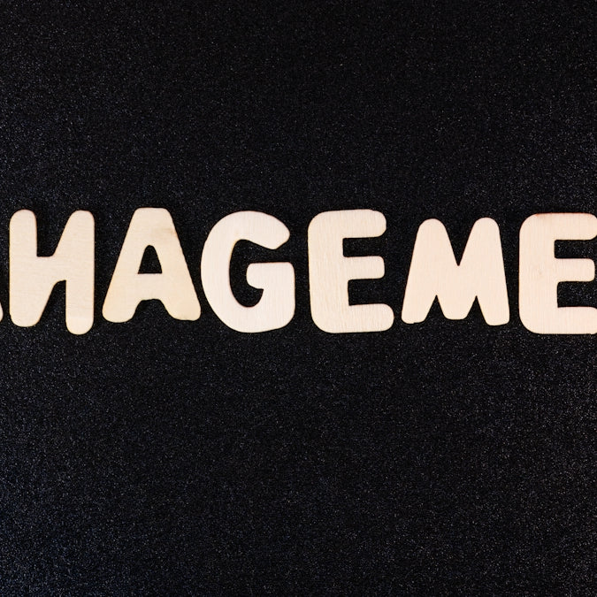 the word management written in white letters on a black background
