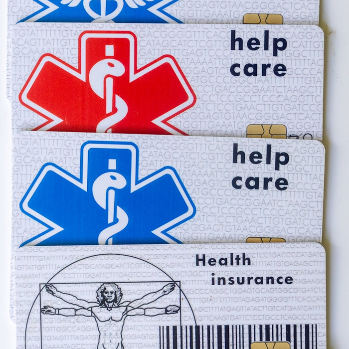 Three medical id badges with a cadus symbol on them