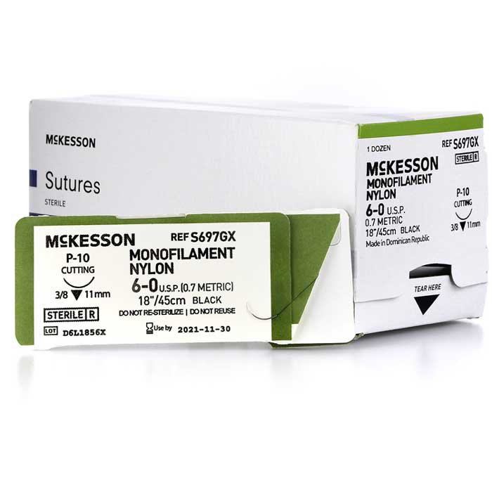 A selection of nylon sutures in sealed packages, displayed with surgical scissors and needle holders, highlighting their use in durable wound closure and surgical precision.