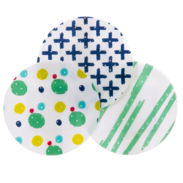 Adhesive Spot Bandages 1 inch Round on a table, used for covering minor cuts, scrapes, and ensuring breathable wound protection.