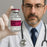 Doctor holding a bottle of Bacteriostatic Water for Infection, USP' with a gray background