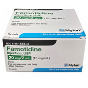 Close-up of Famotidine injection box showing green and blue label with product details, including 20 mg/2 mL dosage, for intravenous use.