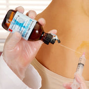 Applying Gebauer Ethyl Chloride to the skin prior to an injection