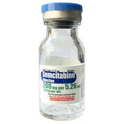 Clear glass vial of Gemcitabine injection 200 mg with blue cap, labeled for cancer treatment, 5.26 mL single dose, RX only
