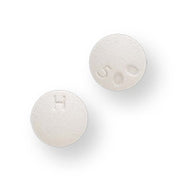 Two white round Hydroxyzine HCL tablets with embossed '4' and '5' markings, used for allergy and anxiety relief