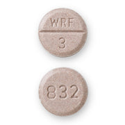 Round beige medication tablet with 'WRF 3' engraved on one side and a line dividing the top and bottom, used for blood thinning
