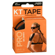KT Tape Kinesiology Tape 10-inch pro strips in jet black color, designed for athletic support and muscle relief, with a woman wearing it on her shoulder